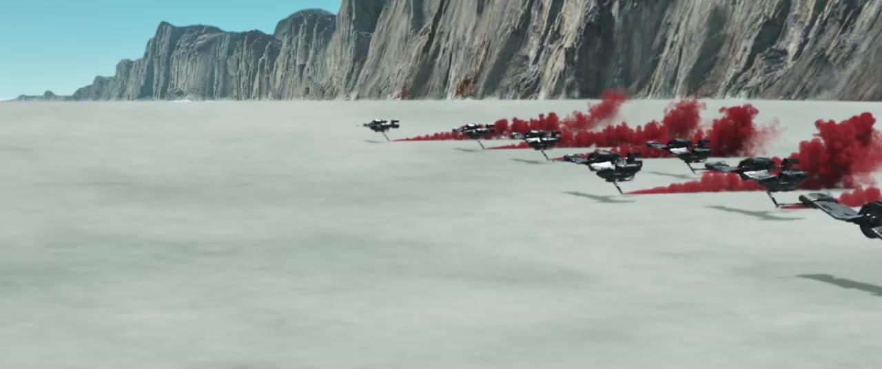 Star Wars speeders crossing Crait with red smoke